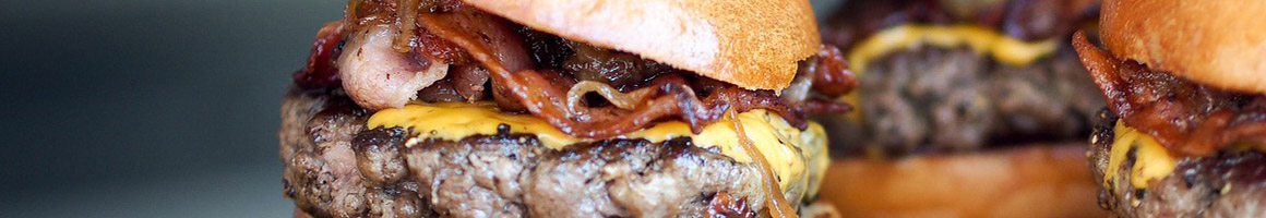 Eating Burger Fast Food at Wings and Burger Haven restaurant in Marietta, GA.
